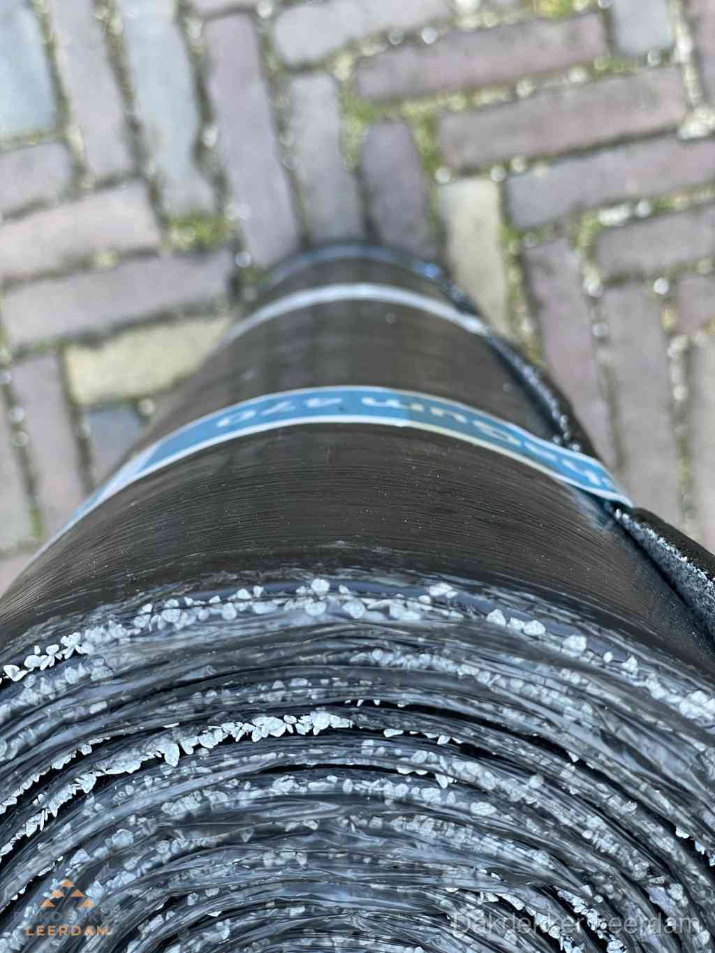 Rol bitumen dakleer met leislag voor plat dak in Leerdam